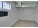 A bright, empty bedroom with a window and wood laminate flooring at 2116 Cameron St, Las Vegas, NV 89102