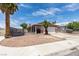 Charming home featuring desert landscaping, an attached garage, and mature trees at 2116 Cameron St, Las Vegas, NV 89102