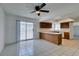 Bright living room features neutral paint, tile flooring, a ceiling fan, and adjoins Kitchen at 2116 Cameron St, Las Vegas, NV 89102