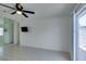 Bright living room features neutral paint, tile flooring, ceiling fan, and a mirrored wall at 2116 Cameron St, Las Vegas, NV 89102