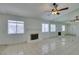 Bright living room featuring a brick fireplace, tile floors, and a mirrored wall at 2116 Cameron St, Las Vegas, NV 89102