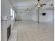 Bright living room with tile floors, a fireplace, a ceiling fan, and a mirrored wall at 2116 Cameron St, Las Vegas, NV 89102