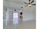 Bright living room features neutral paint, tile flooring, ceiling fan, and access to backyard at 2116 Cameron St, Las Vegas, NV 89102