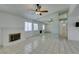 Bright living room features a brick fireplace, tiled floors, and a mirrored wall at 2116 Cameron St, Las Vegas, NV 89102