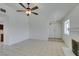 Bright living room features neutral paint, tile flooring, and a ceiling fan at 2116 Cameron St, Las Vegas, NV 89102
