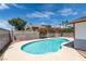 Backyard swimming pool with mature landscaping and privacy wall at 2116 Cameron St, Las Vegas, NV 89102