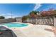 Large backyard swimming pool surrounded by concrete patio with mature landscaping at 2116 Cameron St, Las Vegas, NV 89102