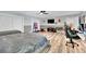 Spacious bedroom with two beds, ceiling fan, and half wall trim with ample space for entertaining and relaxation at 2131 Diamond Bar Dr, Las Vegas, NV 89117