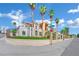 Two story home with well maintained front yard, mature palm trees, and metal fencing on a corner lot at 2131 Diamond Bar Dr, Las Vegas, NV 89117