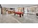 Recreation room with a pool table, a bar with seating, and marble flooring at 2131 Diamond Bar Dr, Las Vegas, NV 89117