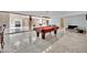 Game room with a pool table, bar area, and marble floors, great for entertaining at 2131 Diamond Bar Dr, Las Vegas, NV 89117