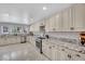 Well-lit kitchen offers granite countertops and updated appliances at 2131 Diamond Bar Dr, Las Vegas, NV 89117