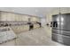 Bright kitchen with modern appliances, gray backsplash, and granite countertops at 2131 Diamond Bar Dr, Las Vegas, NV 89117