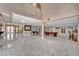 Open-concept living room with high ceilings, pool table, and access to multiple living spaces with marble floors at 2131 Diamond Bar Dr, Las Vegas, NV 89117