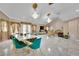Spacious living area features marble floors, elegant chandeliers, dining table, and luxury furniture at 2131 Diamond Bar Dr, Las Vegas, NV 89117