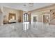 Spacious living room boasts marble floors and a decorative wrought-iron door at 2131 Diamond Bar Dr, Las Vegas, NV 89117