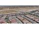 Expansive aerial view showcasing the community layout, homes, and surrounding desert landscape at 2194 Pigeon Hawk St, Las Vegas, NV 89138