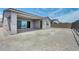 Rear exterior view of house featuring covered patio with tile flooring, and a large gravel yard at 2194 Pigeon Hawk St, Las Vegas, NV 89138
