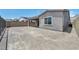 Rear exterior view of house featuring covered patio with tile flooring, and a large gravel yard at 2194 Pigeon Hawk St, Las Vegas, NV 89138