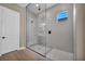 Bathroom showcasing frameless glass shower, gray tile surround and mosaic tile floor at 2194 Pigeon Hawk St, Las Vegas, NV 89138