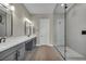Contemporary bathroom with double vanity, walk-in shower, and sleek fixtures at 2194 Pigeon Hawk St, Las Vegas, NV 89138