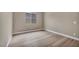 This bedroom features neutral walls, wood flooring, a window for natural light, and a minimalist modern design at 2194 Pigeon Hawk St, Las Vegas, NV 89138