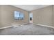Bedroom featuring an exterior door, carpet and scenic views from the window at 2194 Pigeon Hawk St, Las Vegas, NV 89138