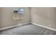 Bedroom showcasing gray carpet, a window, and neutral colored walls, ideal for rest and relaxation at 2194 Pigeon Hawk St, Las Vegas, NV 89138