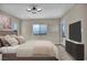 Stylishly decorated bedroom featuring a plush bed, modern lighting, and a scenic view at 2194 Pigeon Hawk St, Las Vegas, NV 89138