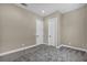 Bedroom featuring neutral walls, carpet, and a pair of doors, creating a serene atmosphere at 2194 Pigeon Hawk St, Las Vegas, NV 89138