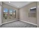 Neutral bedroom with three windows offering mountain views at 2194 Pigeon Hawk St, Las Vegas, NV 89138