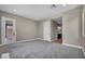 Spacious bedroom with carpeted floors, neutral walls, closet and access to bathroom at 2194 Pigeon Hawk St, Las Vegas, NV 89138