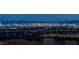 Panoramic nighttime view showcasing the Las Vegas skyline and distant mountains at 2194 Pigeon Hawk St, Las Vegas, NV 89138