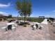 Outdoor community amenity with picnic tables and stone seating at 2194 Pigeon Hawk St, Las Vegas, NV 89138