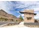 Falcon Crest community entrance monument with mountain views and nearby homes at 2194 Pigeon Hawk St, Las Vegas, NV 89138