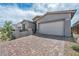 Well-kept single-Gathering home featuring a brick driveway, neutral exterior, and attached two-car garage at 2194 Pigeon Hawk St, Las Vegas, NV 89138
