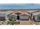 Beautiful single-story home features stone accents, tile roof, and a two-car garage at 2194 Pigeon Hawk St, Las Vegas, NV 89138