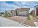 Attractive single-Gathering home showcasing a brick driveway, low-maintenance landscaping, and modern architectural design at 2194 Pigeon Hawk St, Las Vegas, NV 89138