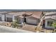 Charming single-story house features a stone facade and a two-car garage at 2194 Pigeon Hawk St, Las Vegas, NV 89138