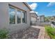 Exterior home featuring a brick driveway, manicured landscaping, and windows that offering views of the nearby mountains at 2194 Pigeon Hawk St, Las Vegas, NV 89138