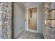 Modern front door with stone accents and paver walkway at 2194 Pigeon Hawk St, Las Vegas, NV 89138