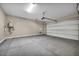 Spacious two-car garage with concrete flooring and a modern garage door at 2194 Pigeon Hawk St, Las Vegas, NV 89138