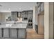 Gray kitchen cabinets surround a center island, and modern stainless steel appliances at 2194 Pigeon Hawk St, Las Vegas, NV 89138