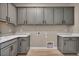 Laundry room featuring gray cabinets, white countertops, and modern appliances hookups at 2194 Pigeon Hawk St, Las Vegas, NV 89138