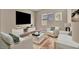 Cozy, staged living room featuring stylish furniture and neutral decor at 2194 Pigeon Hawk St, Las Vegas, NV 89138