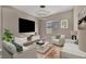 Inviting living room with stylish decor, comfortable seating, and contemporary lighting, creating a cozy ambiance at 2194 Pigeon Hawk St, Las Vegas, NV 89138