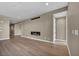This home's living area features a sleek fireplace, wood floors, and access to other areas of the home at 2194 Pigeon Hawk St, Las Vegas, NV 89138