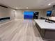 Bright and spacious living room with a modern fireplace, an open kitchen, and large sliding doors at 2194 Pigeon Hawk St, Las Vegas, NV 89138