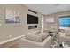 Cozy living room featuring contemporary decor, a modern fireplace, large screen television, and comfortable seating at 2194 Pigeon Hawk St, Las Vegas, NV 89138