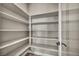 Walk-in pantry with multiple shelves for organized storage at 2194 Pigeon Hawk St, Las Vegas, NV 89138